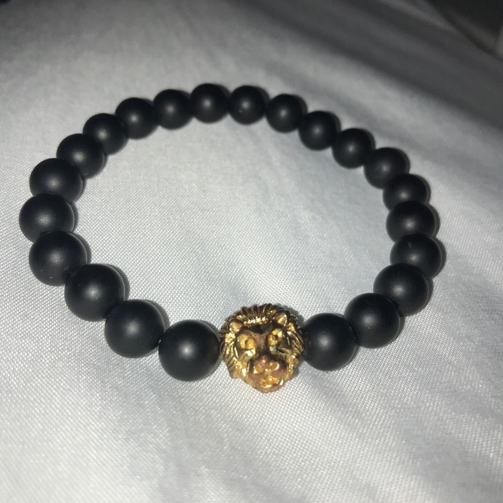 Gold save the lions bracelet